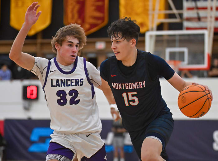 Montgomery's JJ Sanchez dribbles past Carlsbad's Jett Kenady in December's matchup